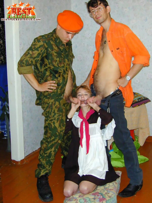 Young Russian girl with red hair gets double fucked by resistance fighters page 1