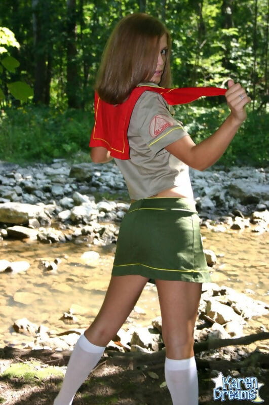 Naughty teen girl teases next to a stream in her Girl Guides uniform page 1