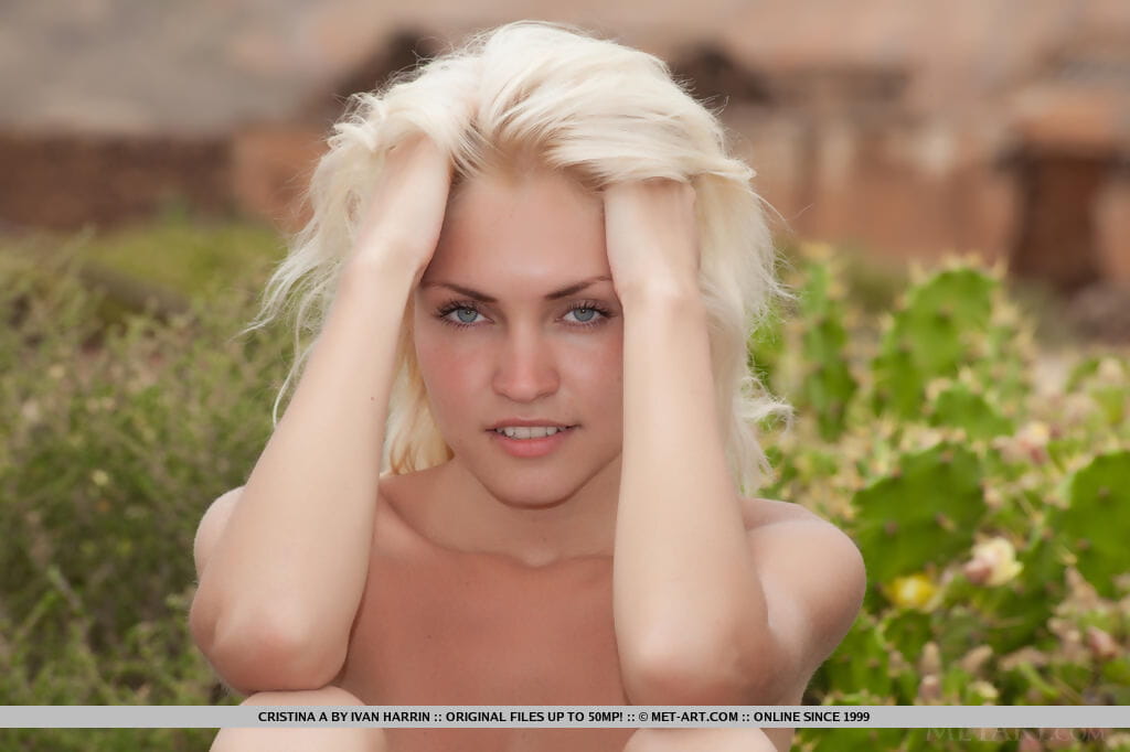 Young blonde girl Cristina A models naked in foothills of Russian mountains page 1