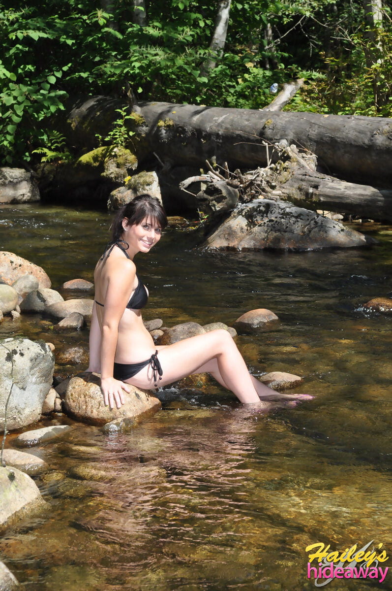 Brunette amateur Hailey removes her bikini to show wet nice tits in the river page 1