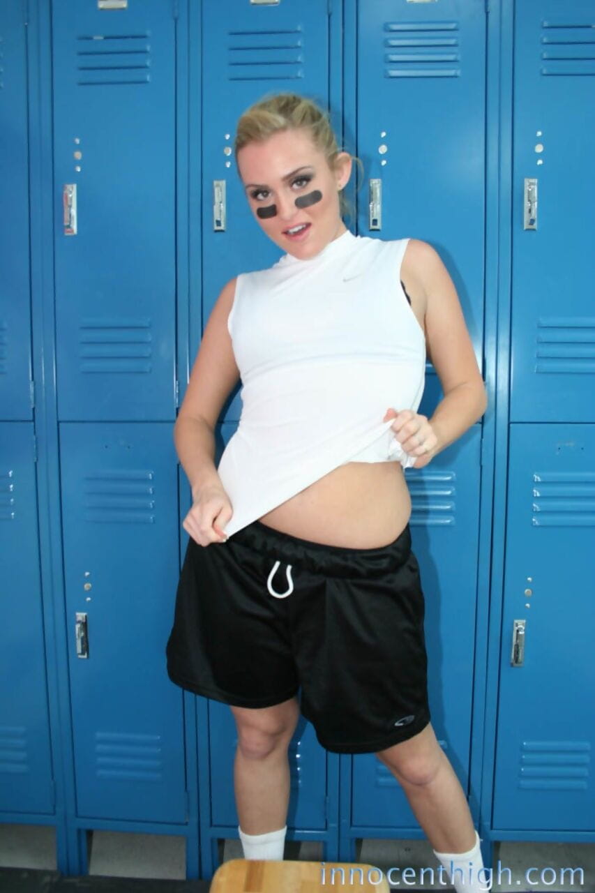 Cute football bitch Ruby Ryder strips her uniform and shows her lovely body page 1