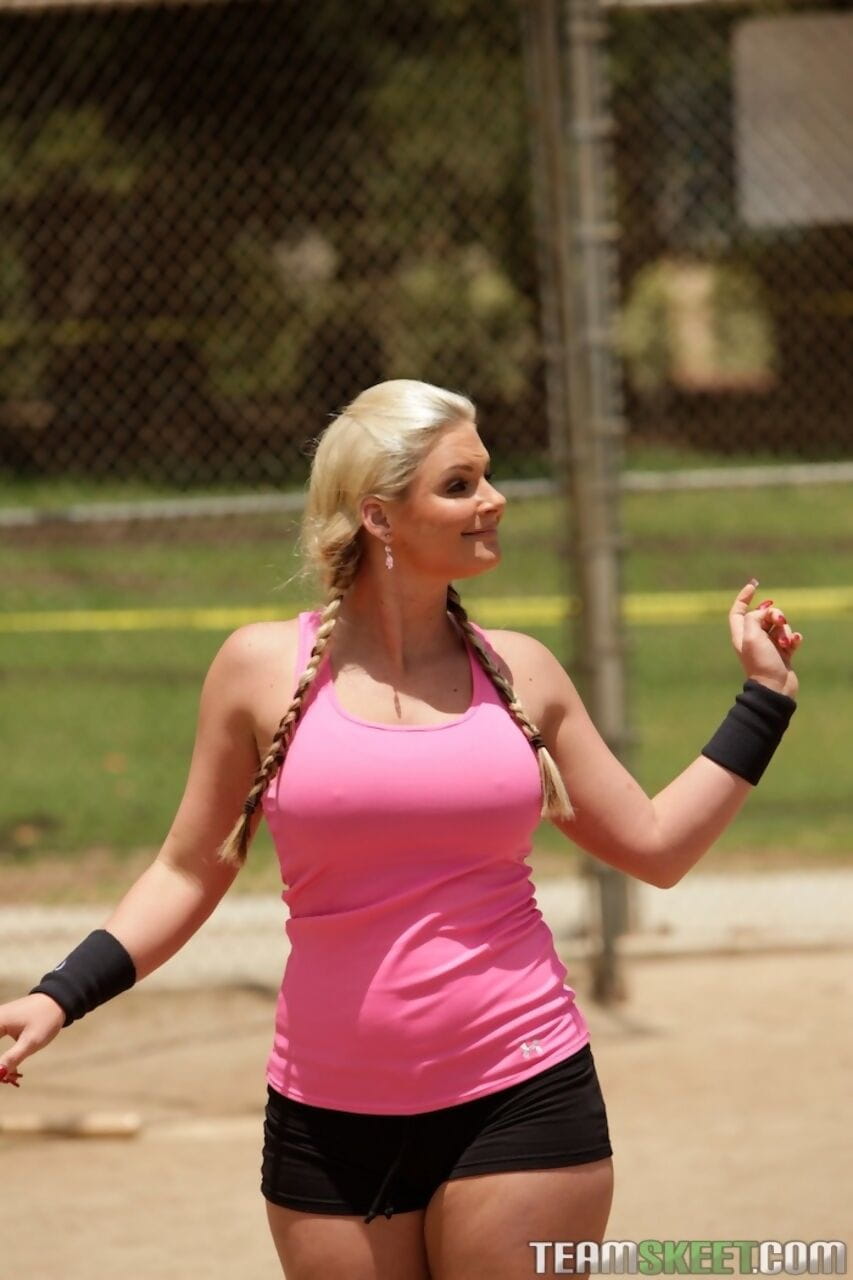 Pigtailed ball player Phoenix Marie exposes round big tits on the diamond page 1