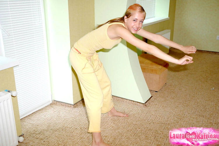 Young blonde girl does her daily stretching with her clothes on page 1