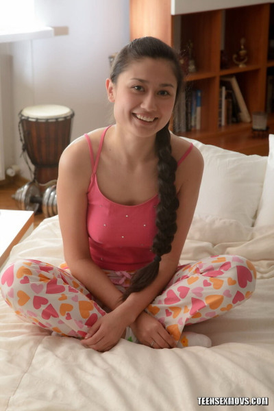Teen girl wears hair in braided ponytail while getting banged in white socks